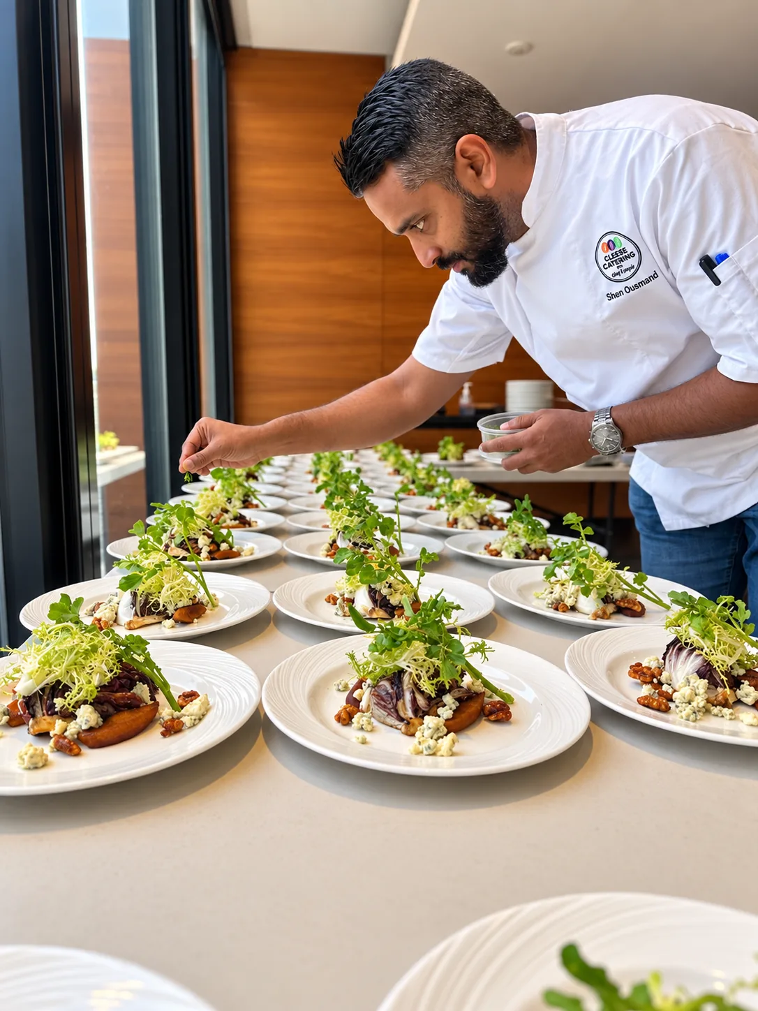 Chef Shen plating a salad course for service