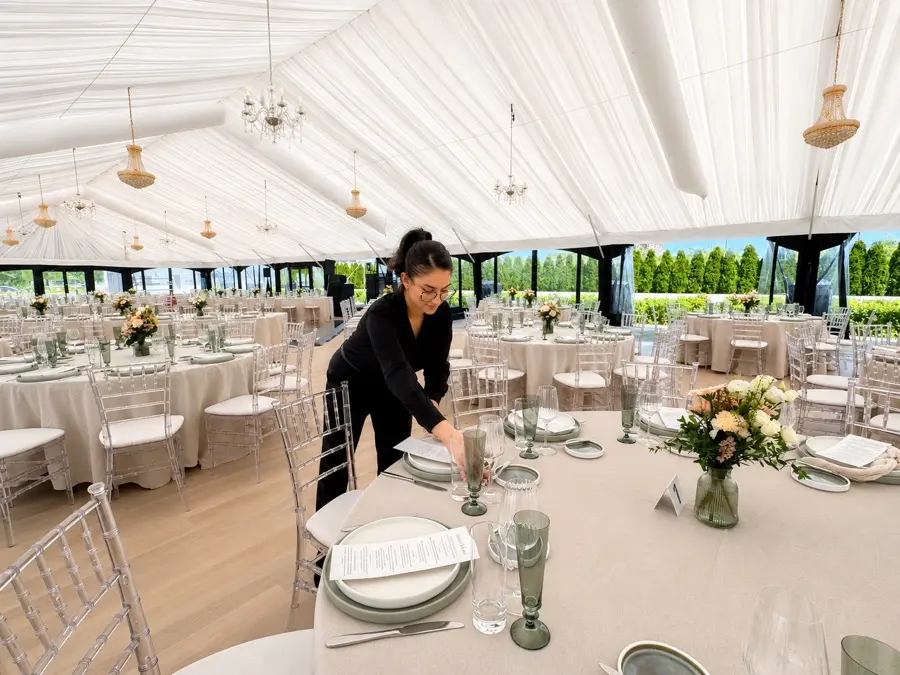 Setting tables for a marquee reception